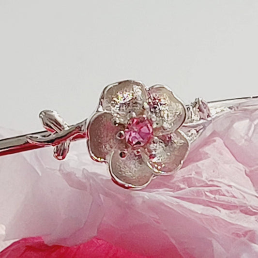 Rhodium plated pink rose charm open bangle